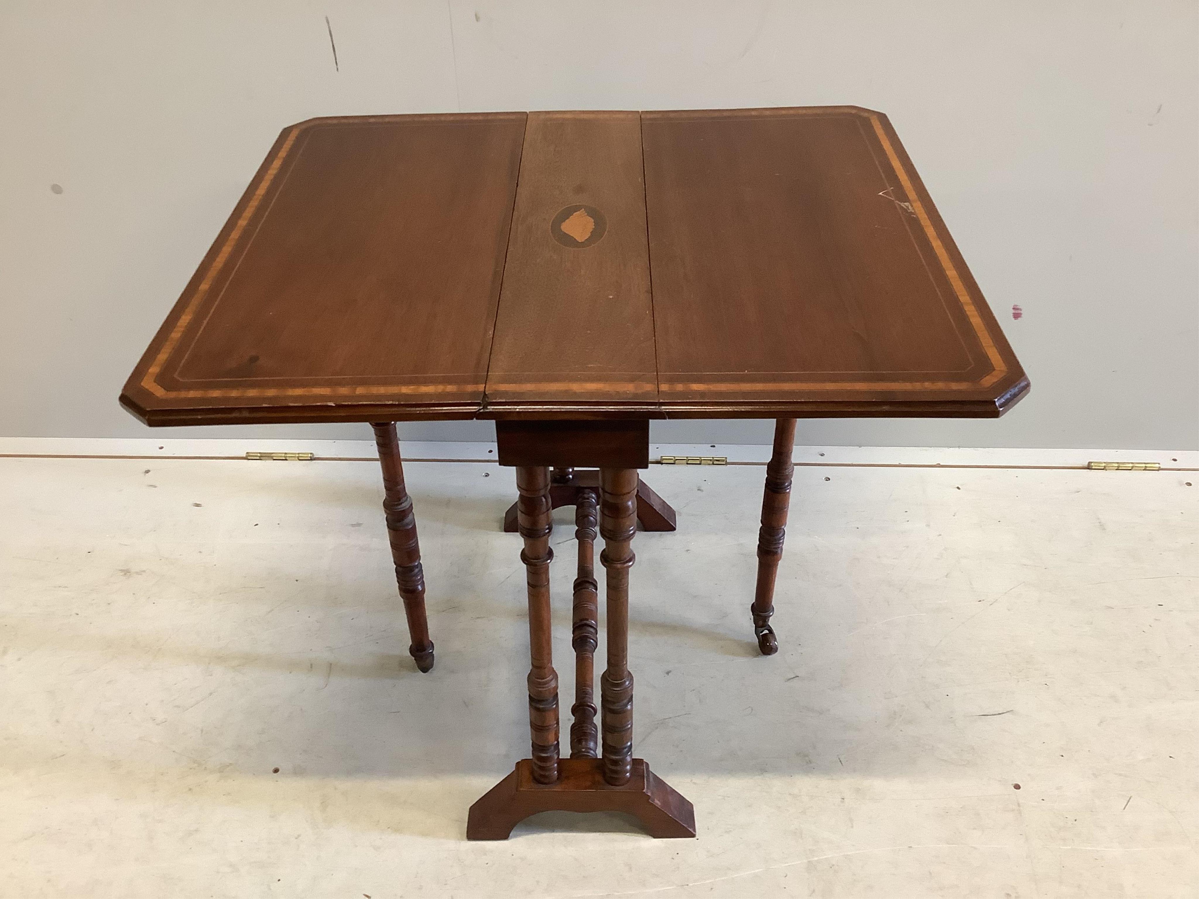 A late Victorian satinwood banded mahogany Sutherland table, width 61cm, depth 16cm, height 63cm. Condition - fair